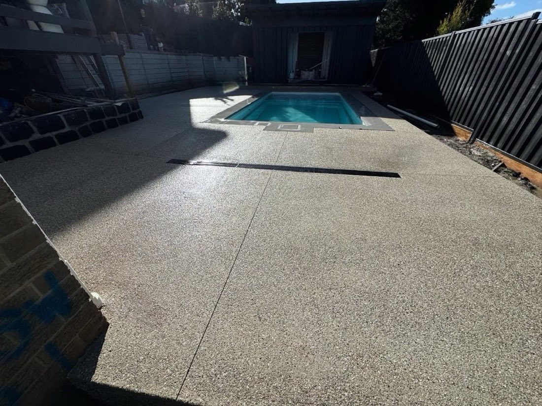 Exposed aggregate pool surround