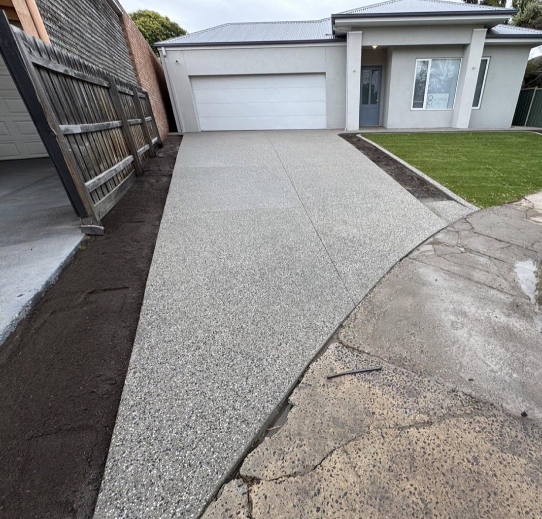 Fresh exposed aggregate driveway to a double garage